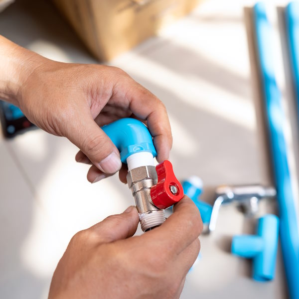 plumber putting teflon thread tape on the thread , Preparing to